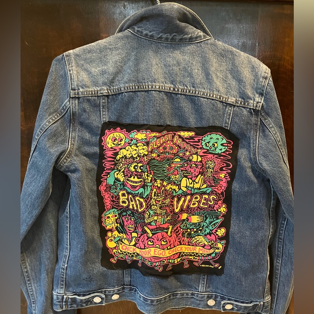 Upcycled jean jacket with graphic on back
